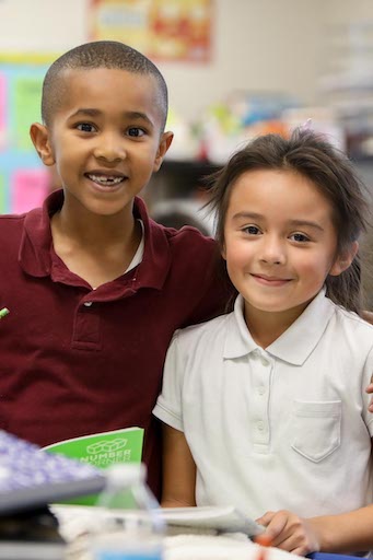 Two students posing in class